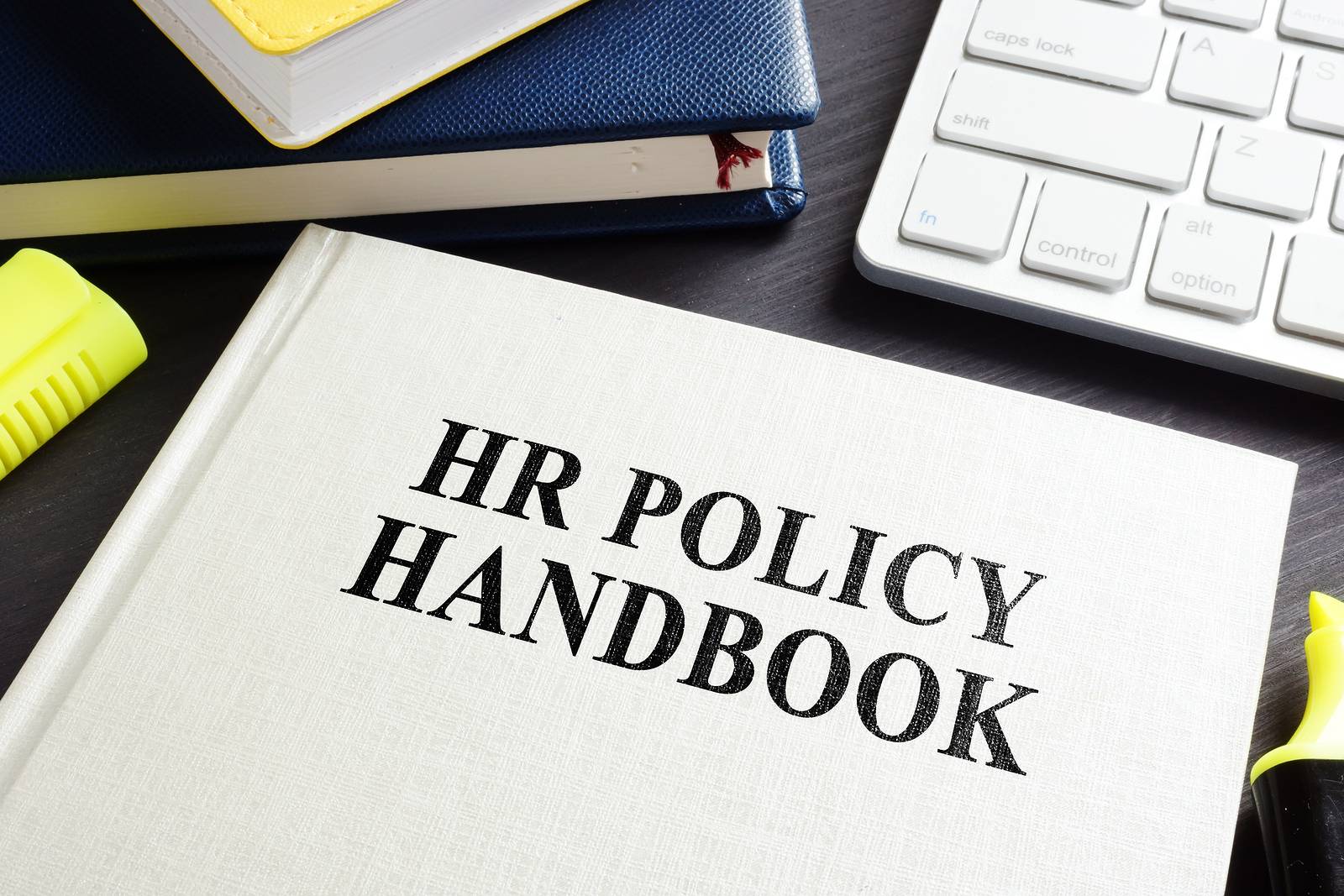 HR policy handbook on a desk